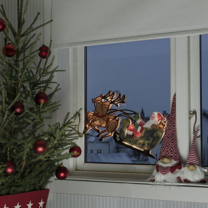 Père Noël avec silhouette de fenêtre de Rennes et traîneau
